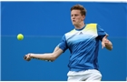 EASTBOURNE, ENGLAND - JUNE 14: Scott Clayton of Great Britain plays a forehand against Chris Guccione of Australia during their Men's Singles qualifying match on day one of the Aegon International at Devonshire Park on June 14, 2014 in Eastbourne, England.  (Photo by Steve Bardens/Getty Images)